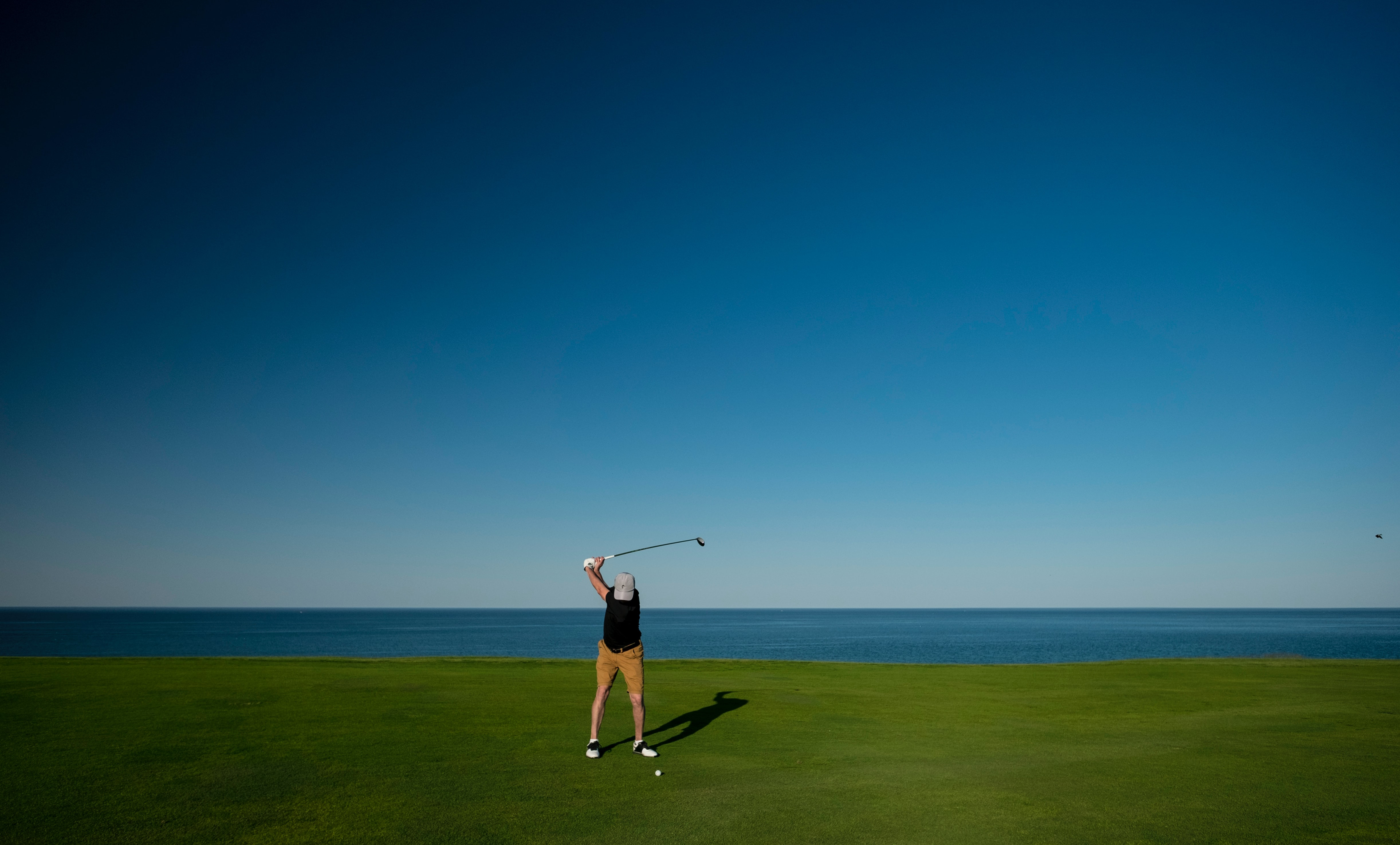 Man Golfing in Whistling Straits